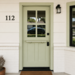 Beautiful Dutch-style split front door featuring Benjamin Moore Lily Pad, professionally finished by Paintmasters.