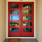 Beautiful modern double entry doors featuring a bold red finish by Paintmasters.