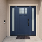A striking Craftsman entry in deep navy blue, framed by frosted sidelights and crisp trim—finished by Paintmasters.