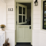 Beautiful Dutch-style split front door featuring Benjamin Moore Lily Pad, professionally finished by Paintmasters.