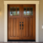Paintmasters created a custom stain and refinished these double entry doors to enhance the wood grain and restore their rich, warm tone.