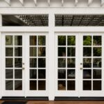 Elegant French doors with transom windows painted by Paintmasters in Sherwin-Williams Alabaster and installed by Mike Bringle.  