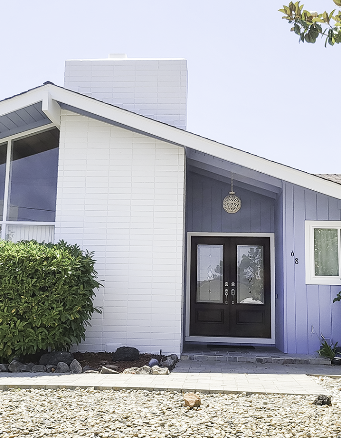 Blue exterior painted home with white fireplace in Moraga CA